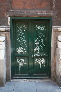 vandalized wall with graffiti 